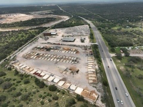 A wooden walkway surrounded by rocks in a garden.
