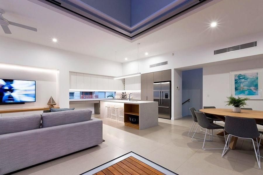 A Living Room With a Couch, Table, Chairs and a Television — Rob Ward Electrical Services in West Ballina, NSW