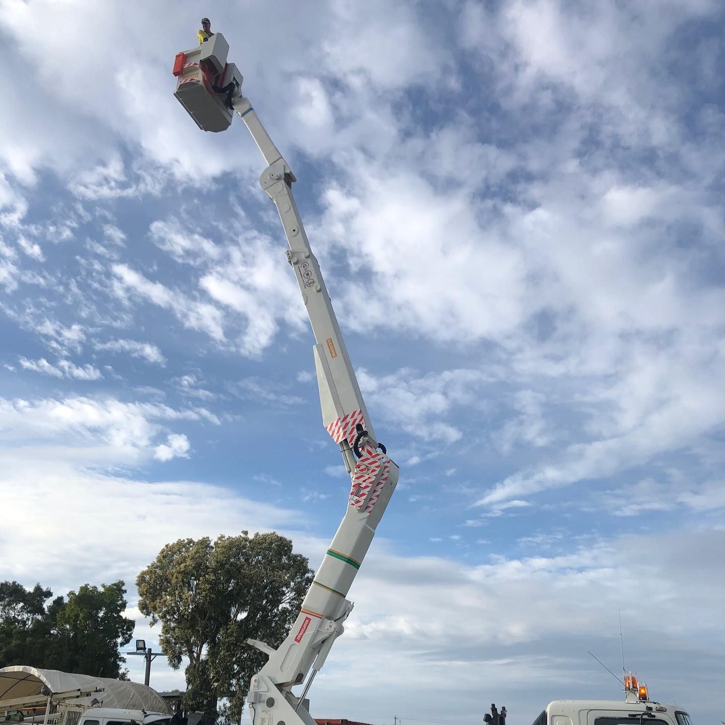 A Crane is Sitting on Top of a Truck With a Blue Sky in the Background — Rob Ward Electrical Services in West Ballina, NSW