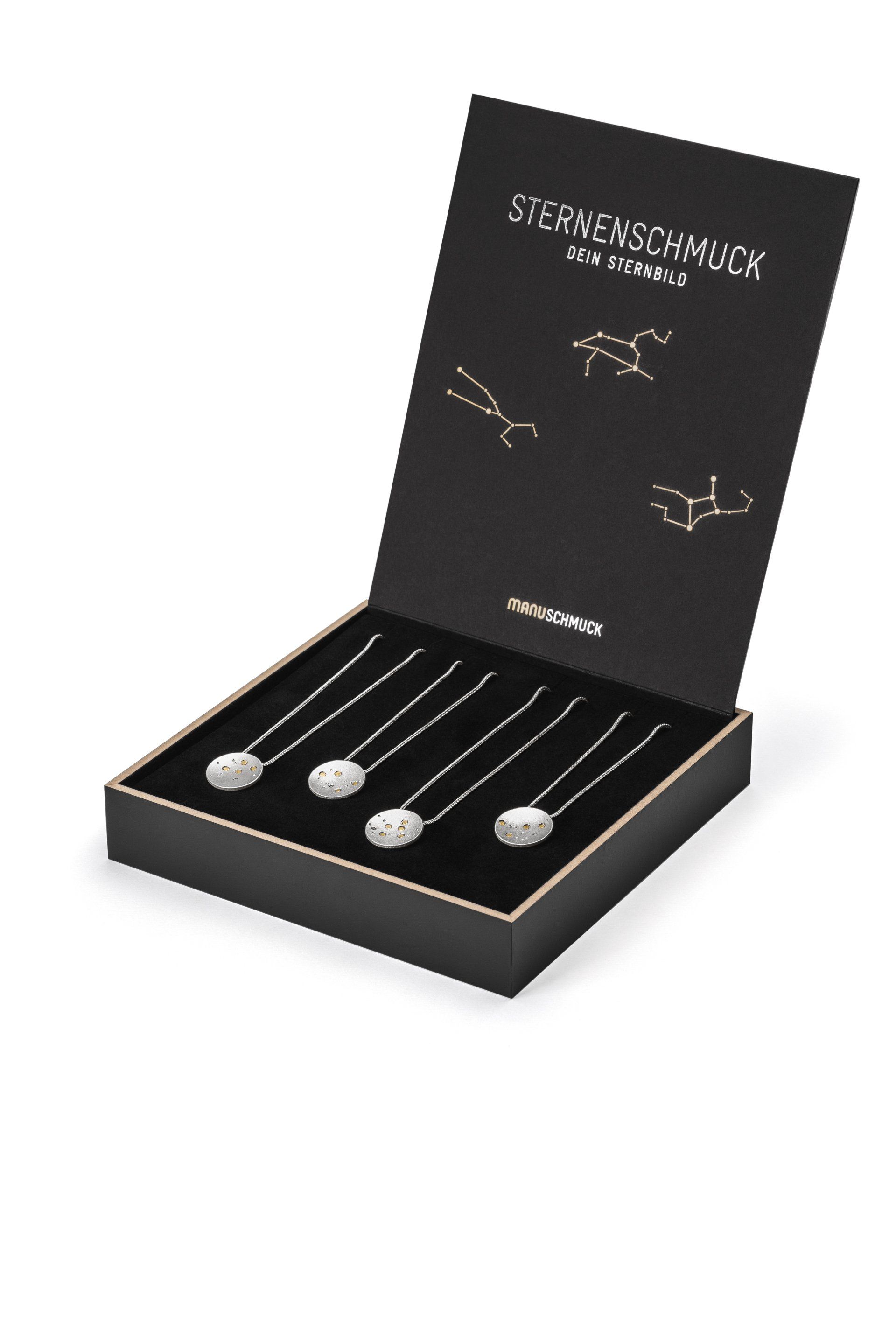 Eine schwarze Schachtel mit vier Halsketten darin.