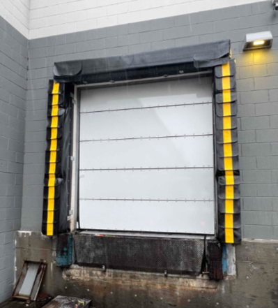 A white door with yellow stripes on the side of it