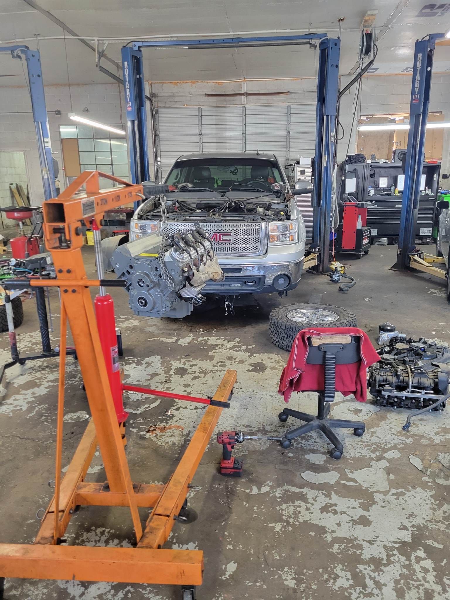 Vehicle Undergoing Repairs Inside an Automotive Service Bay | Devoted Automotive