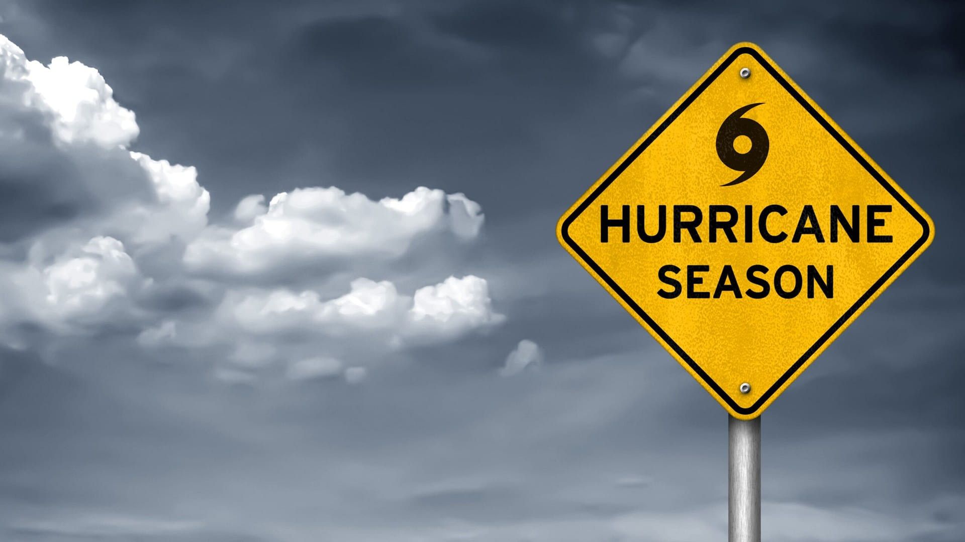 A yellow sign that says hurricane season on it