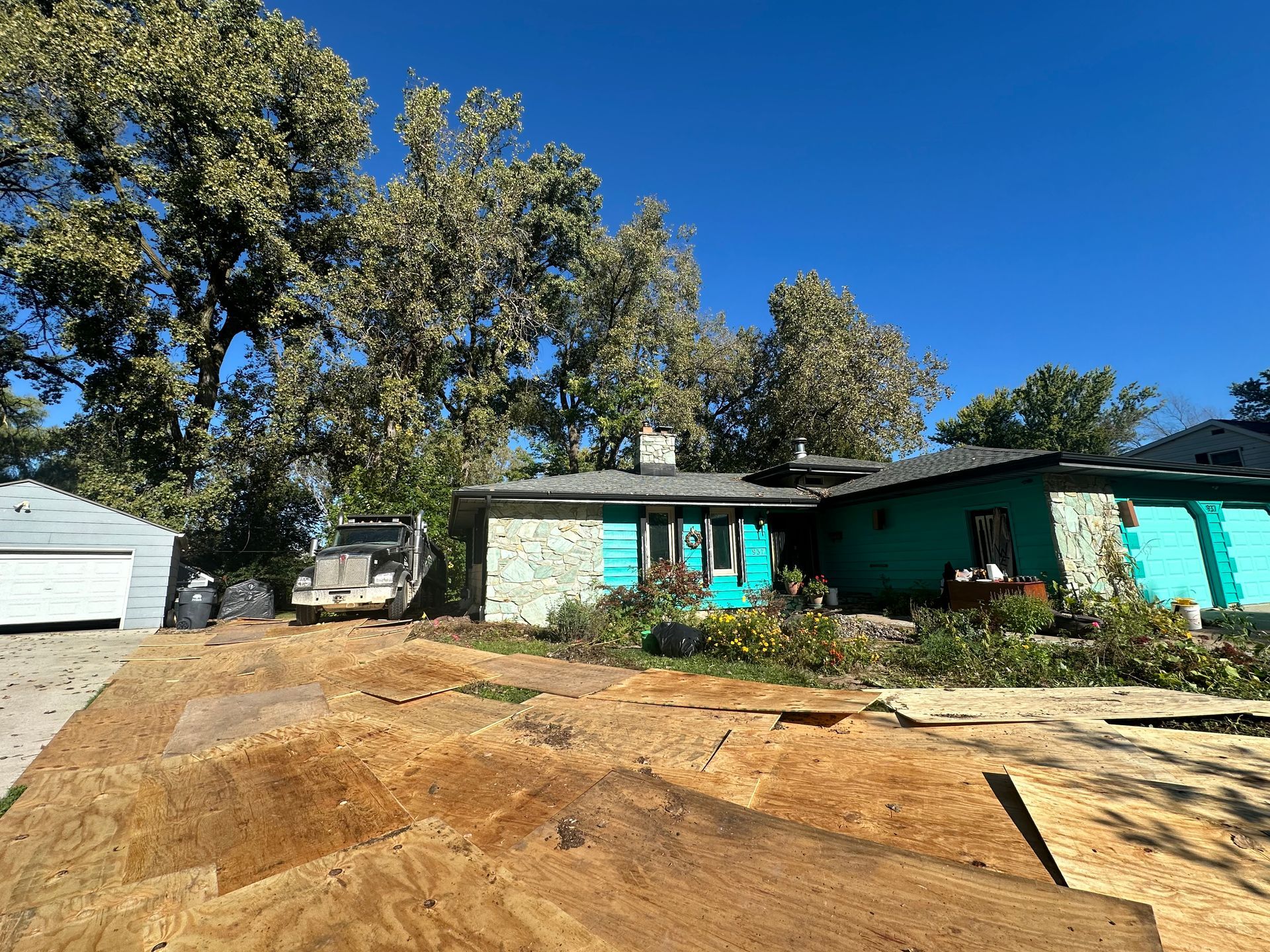 A house with a lot of dirt in front of it.