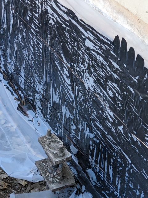 A wall with a lot of black paint on it.