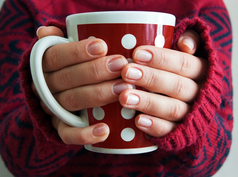 Woman Hands Holding a Mug — Canberra, Act — Healthy Skin Solutions