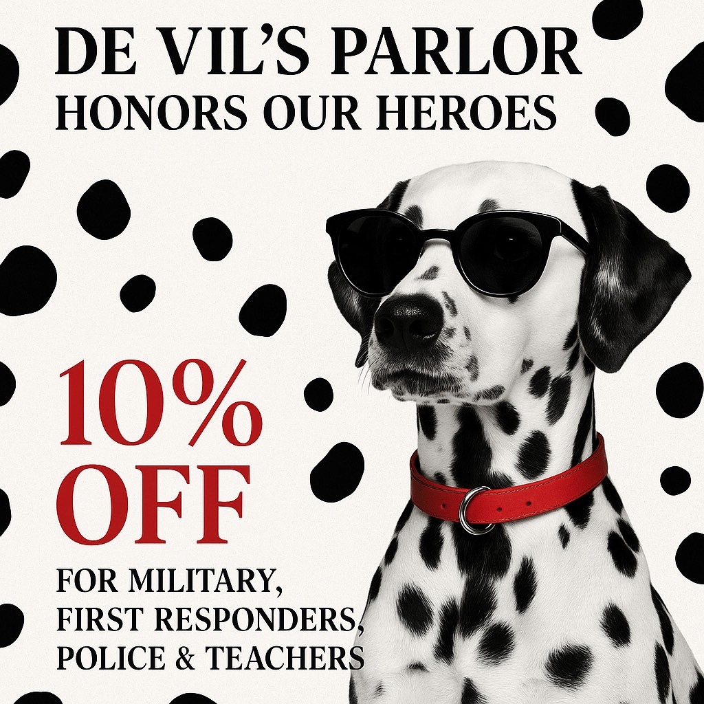 A dalmatian dog wearing sunglasses and a red collar