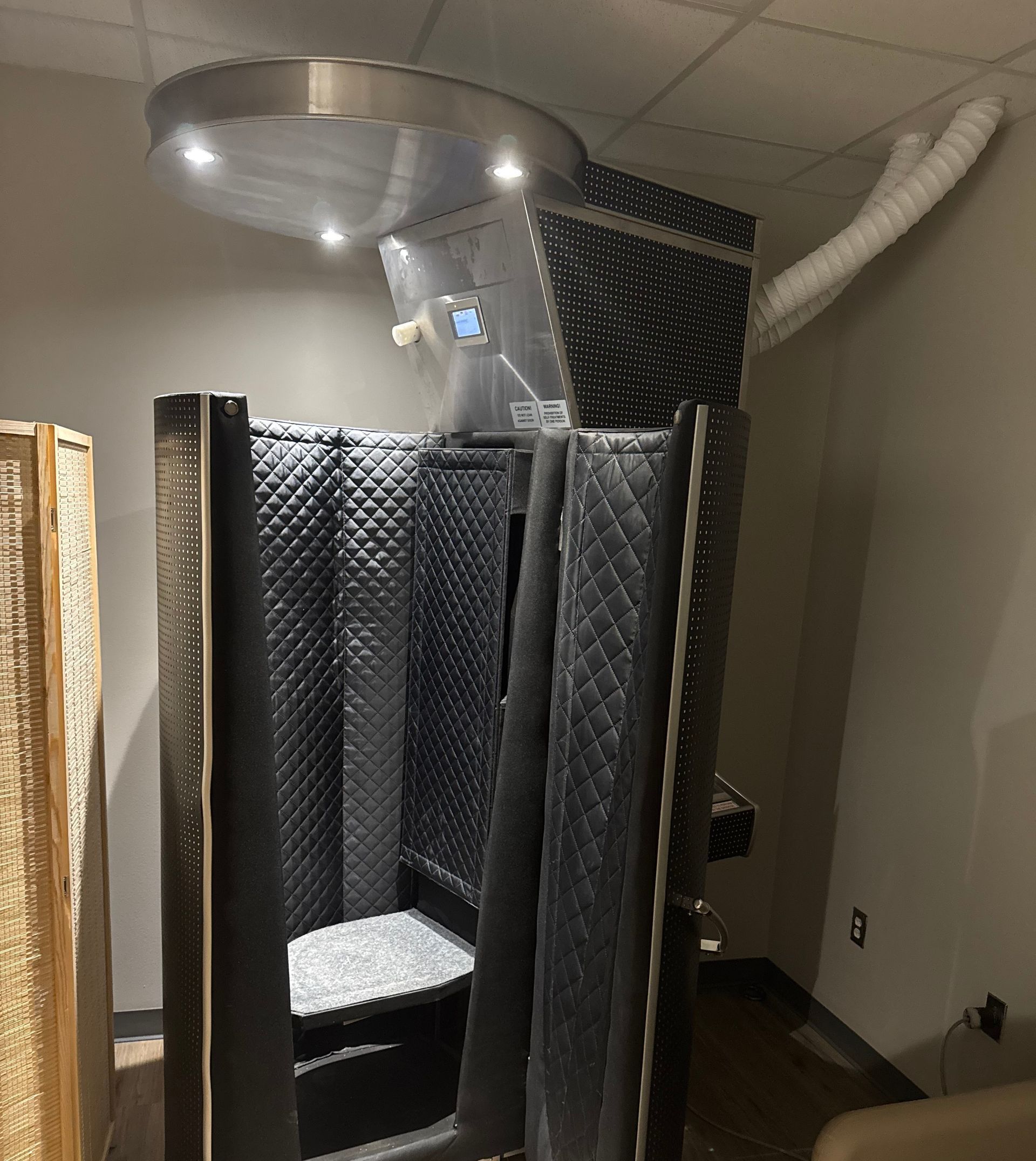 A cryogenic chamber in a treatment room