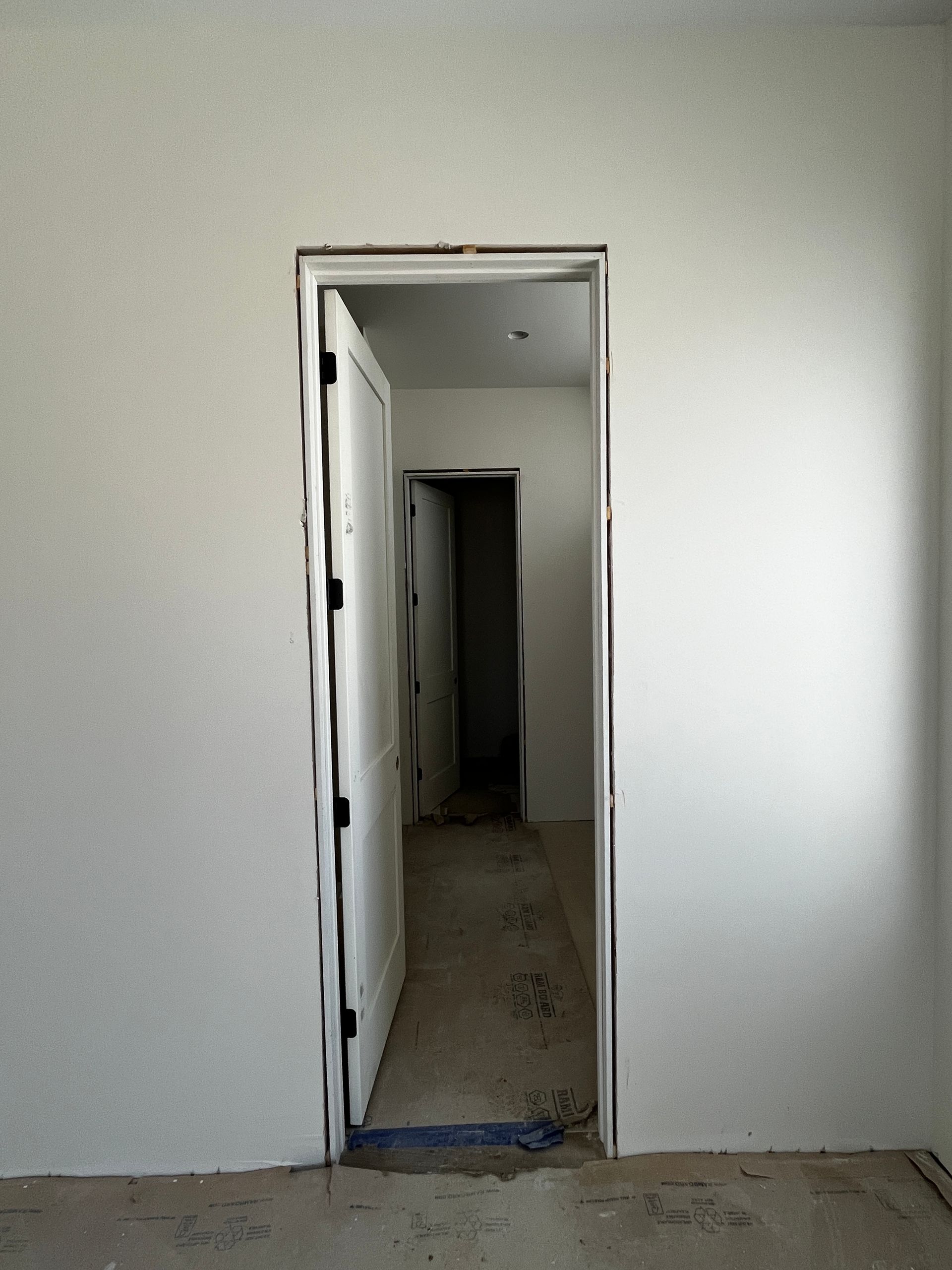 An empty room with a door that is open