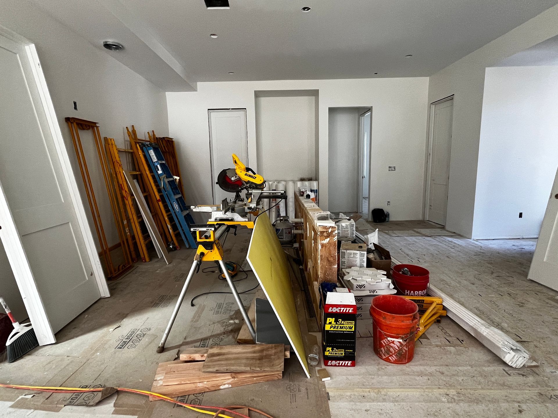 A room that is being remodeled with a lot of tools on the floor