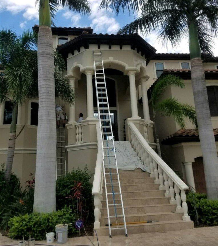 Ladder Outside the House — Tampa, FL — American Painters Inc