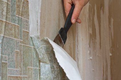 Man Removing the Wallpaper — Tampa, FL — American Painters Inc