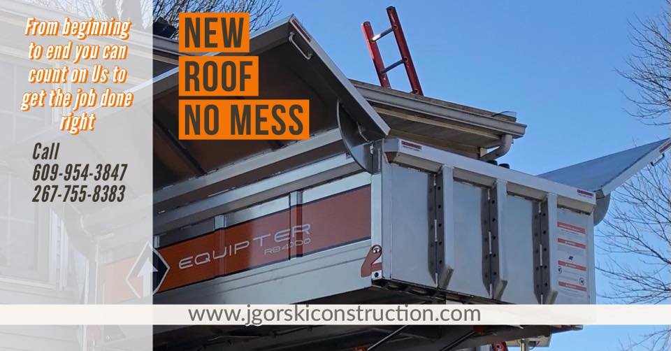 A roof being worked on with debris containment system, banner says 