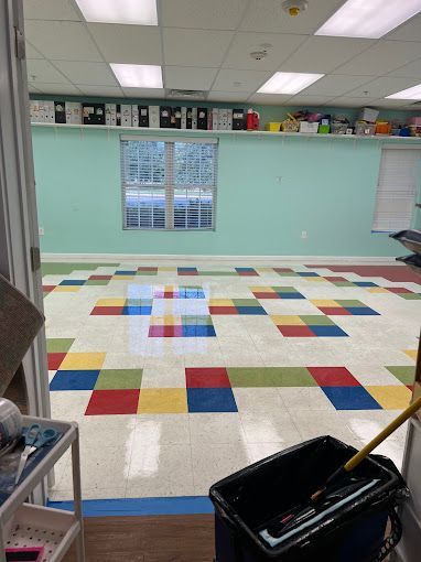 A room with a mop and bucket on the floor