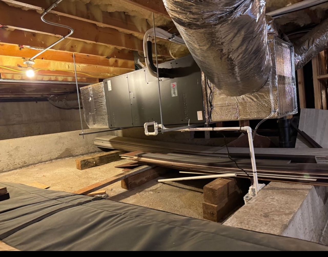 A ceiling with a lot of pipes hanging from it