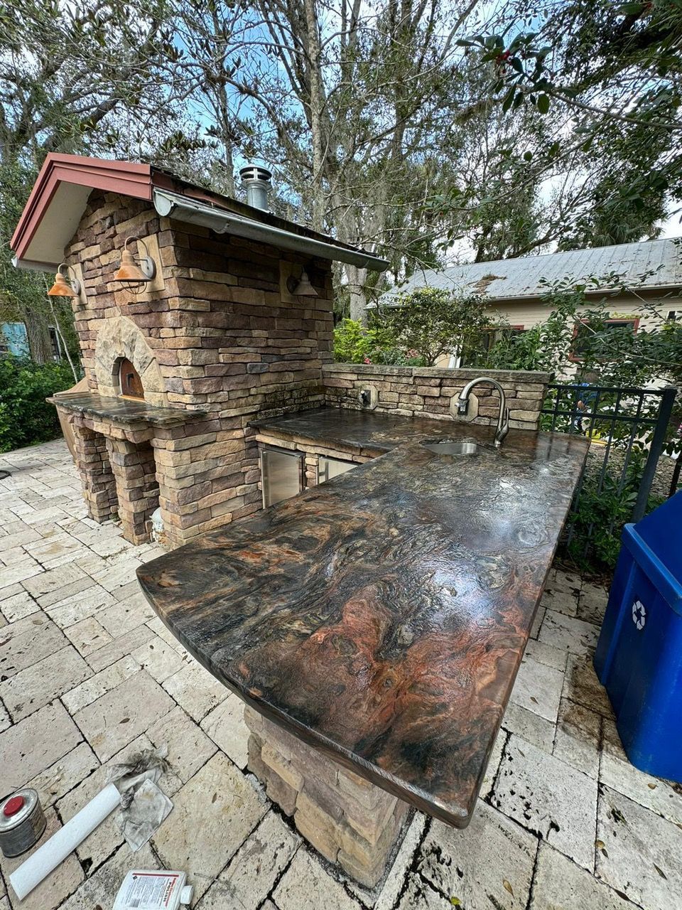 A Living Room With A Fireplace — Fort Myers, FL — Roca Granite & Cabinets