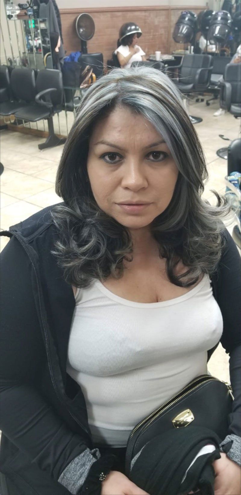 medium length styled hair with black and  light grey highlight