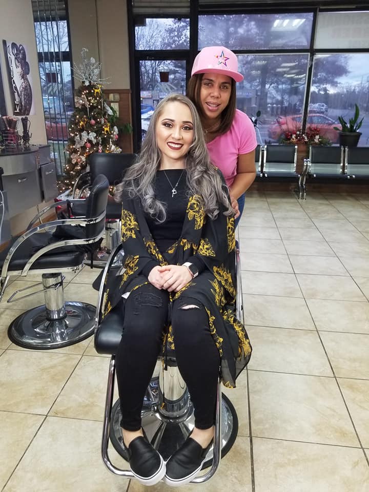 minerva with client show casing her newly styled hair