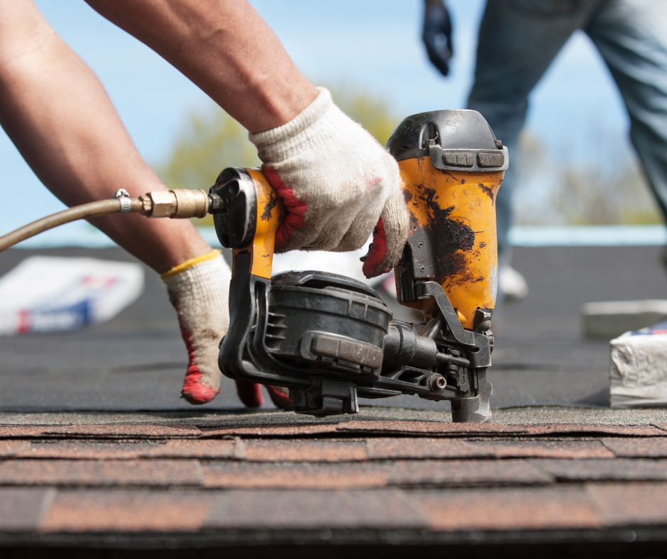 air powered nail gun fixing roofing felt