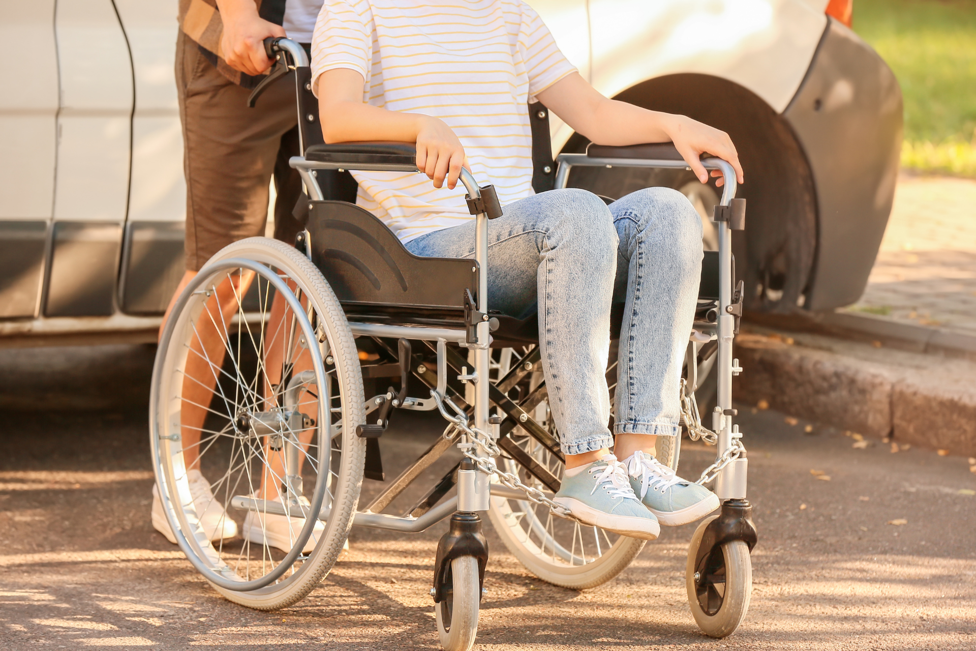 a person in a manually operated wheelchair