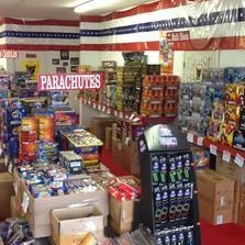 A store filled with lots of fireworks and parachutes.