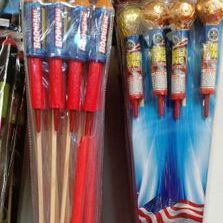 A bunch of fireworks are sitting on a table.