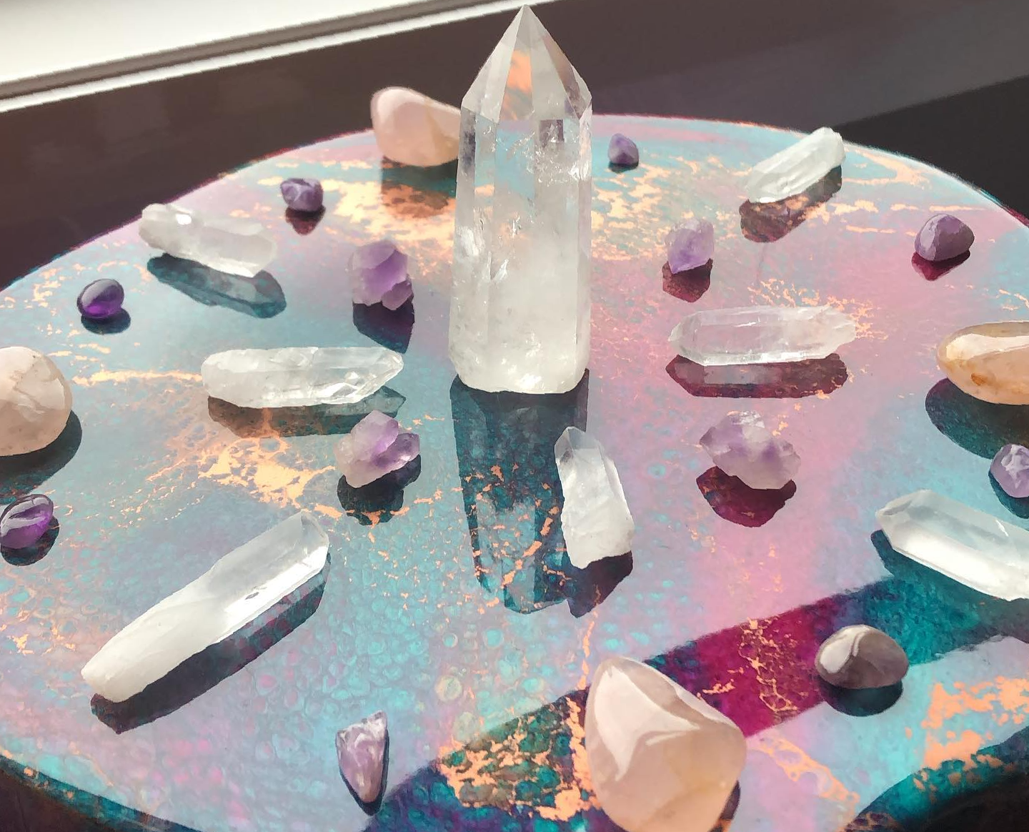 A circle of crystals and stones on a table