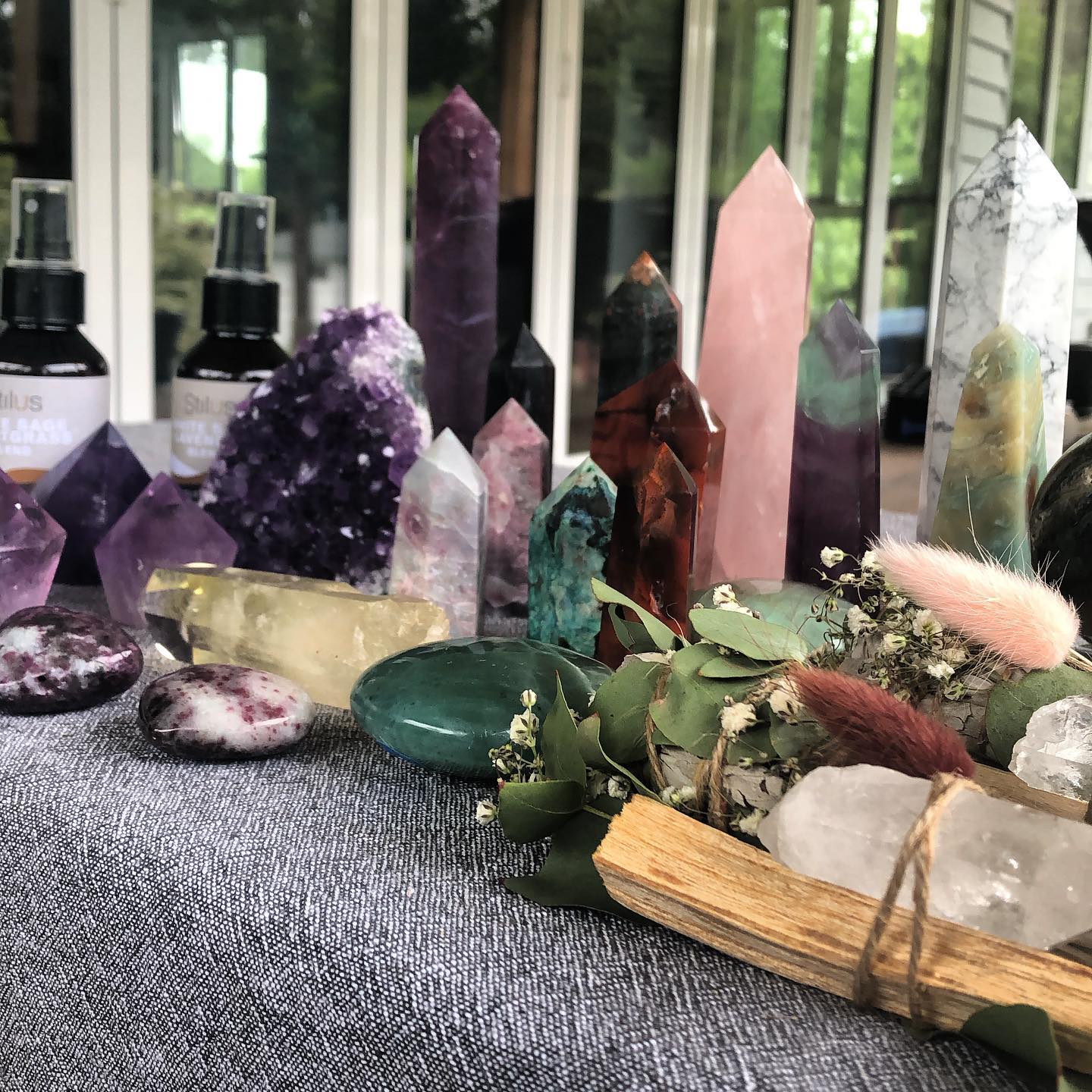 There are many different types of crystals on the table.
