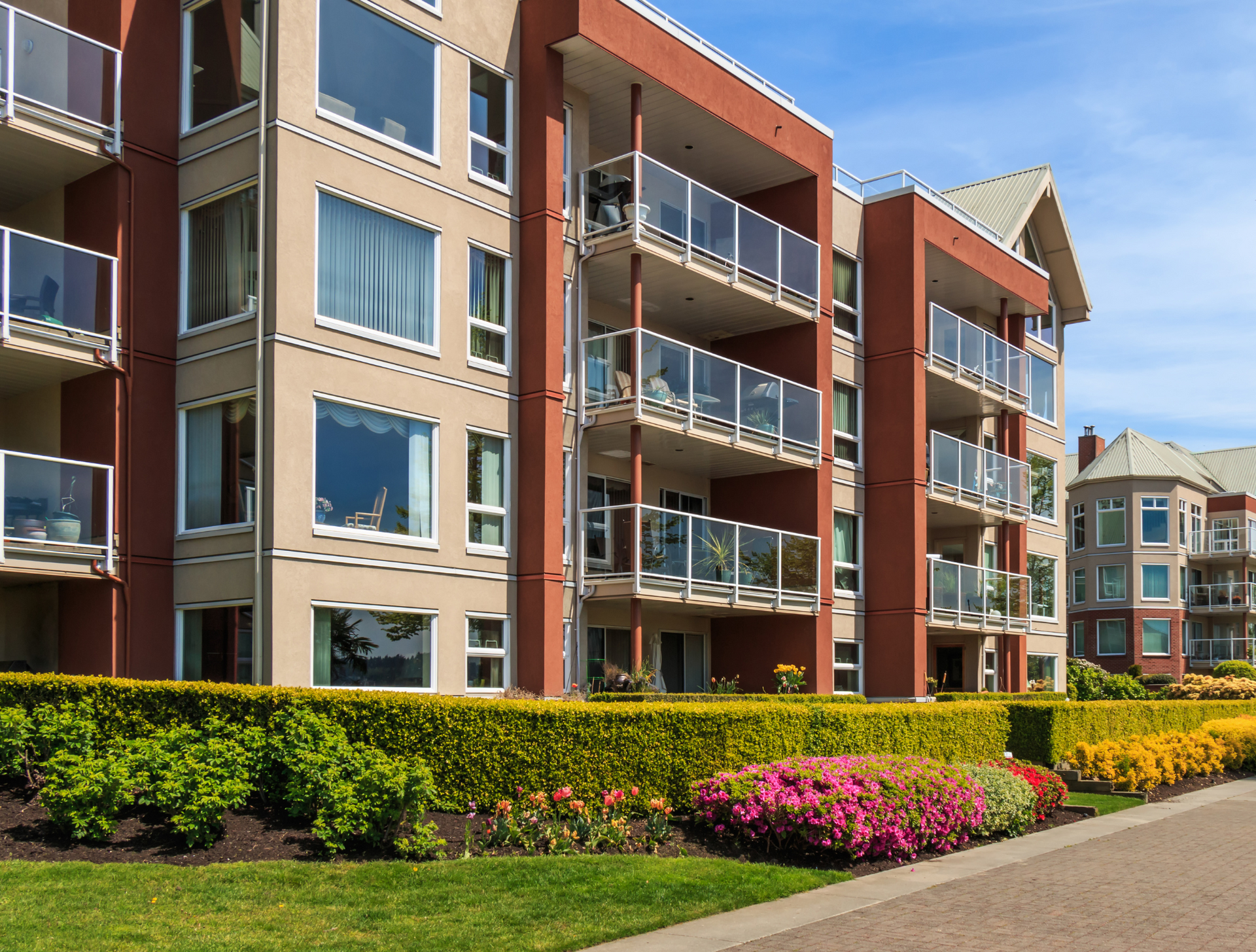 A large apartment building with lots of windows and balconies