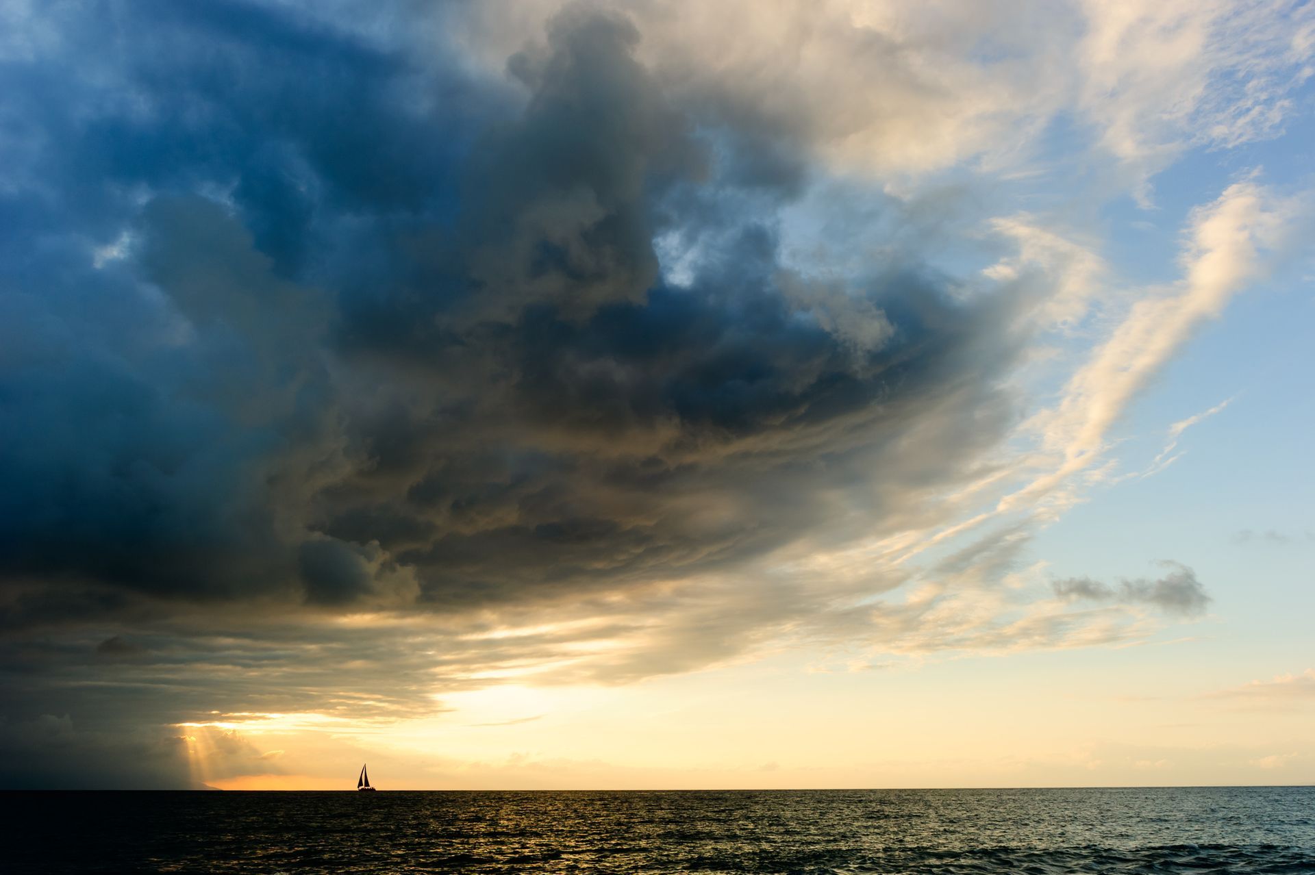 sailboat leaving the storm