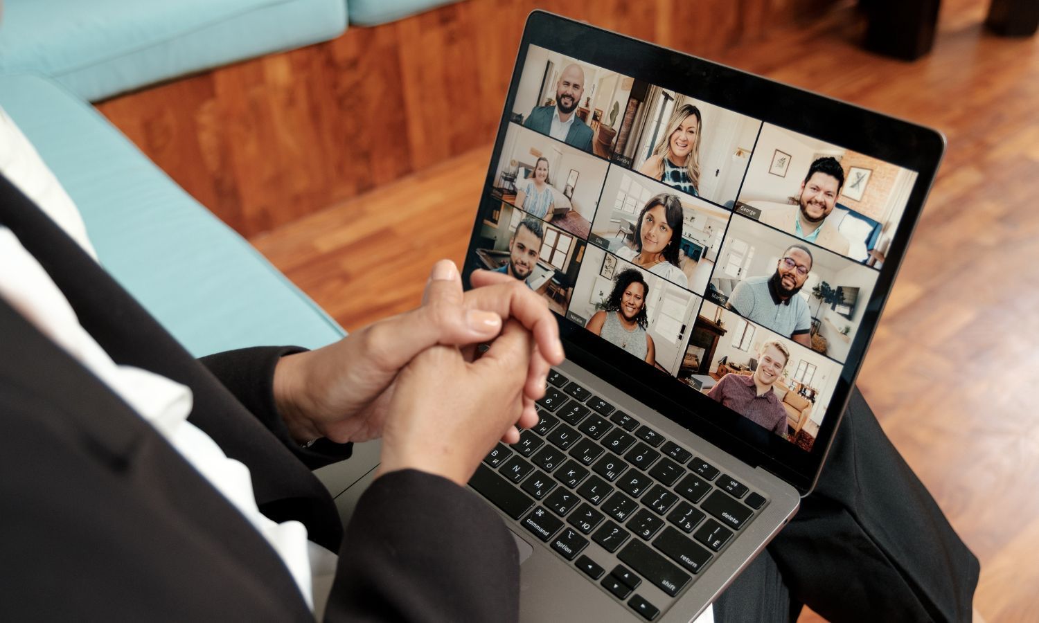 Rollers Media: Laptop in dark setting, keyboard illuminated, screen displaying a file directory, blue light from window.