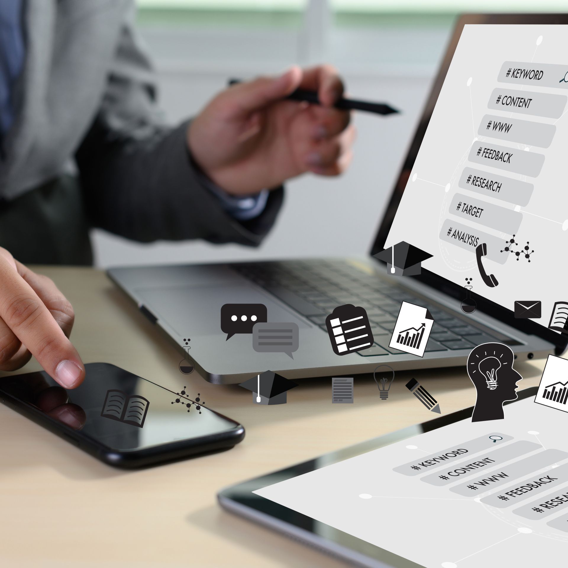 Rollers Media: Person working on a laptop, tablet, and smartphone with business icons overlaid, likely in an office.