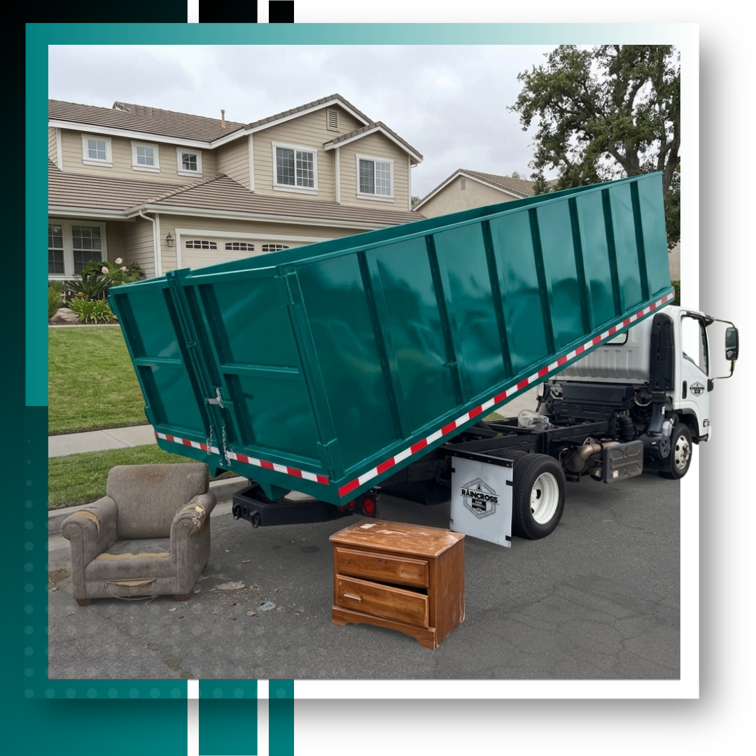 An image of dumpster truck in front of a house