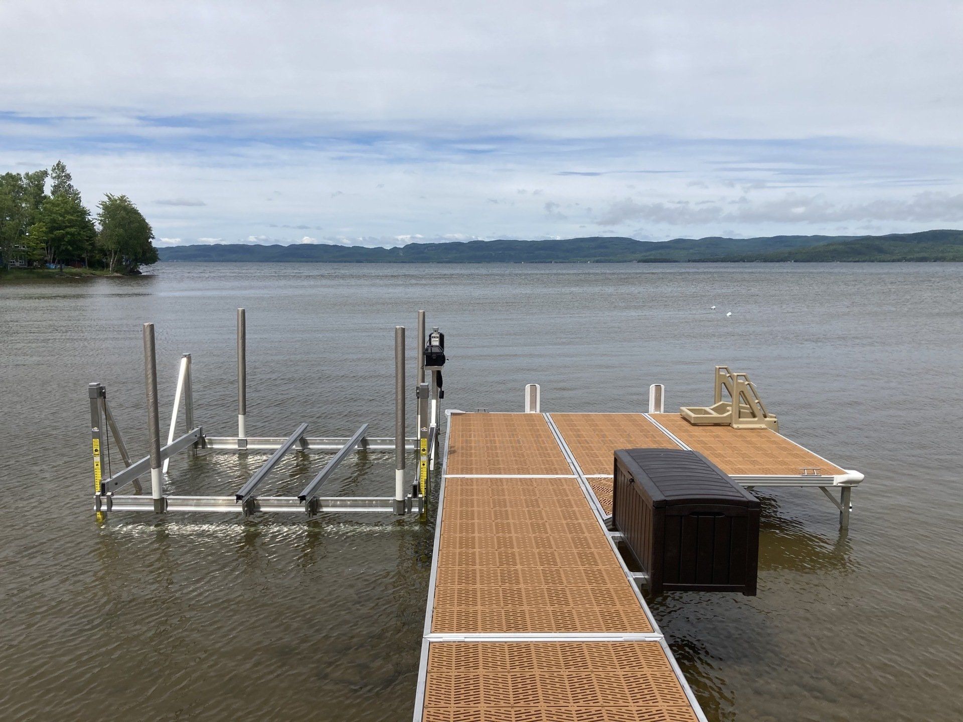 A large body of water with a dock in the middle of it