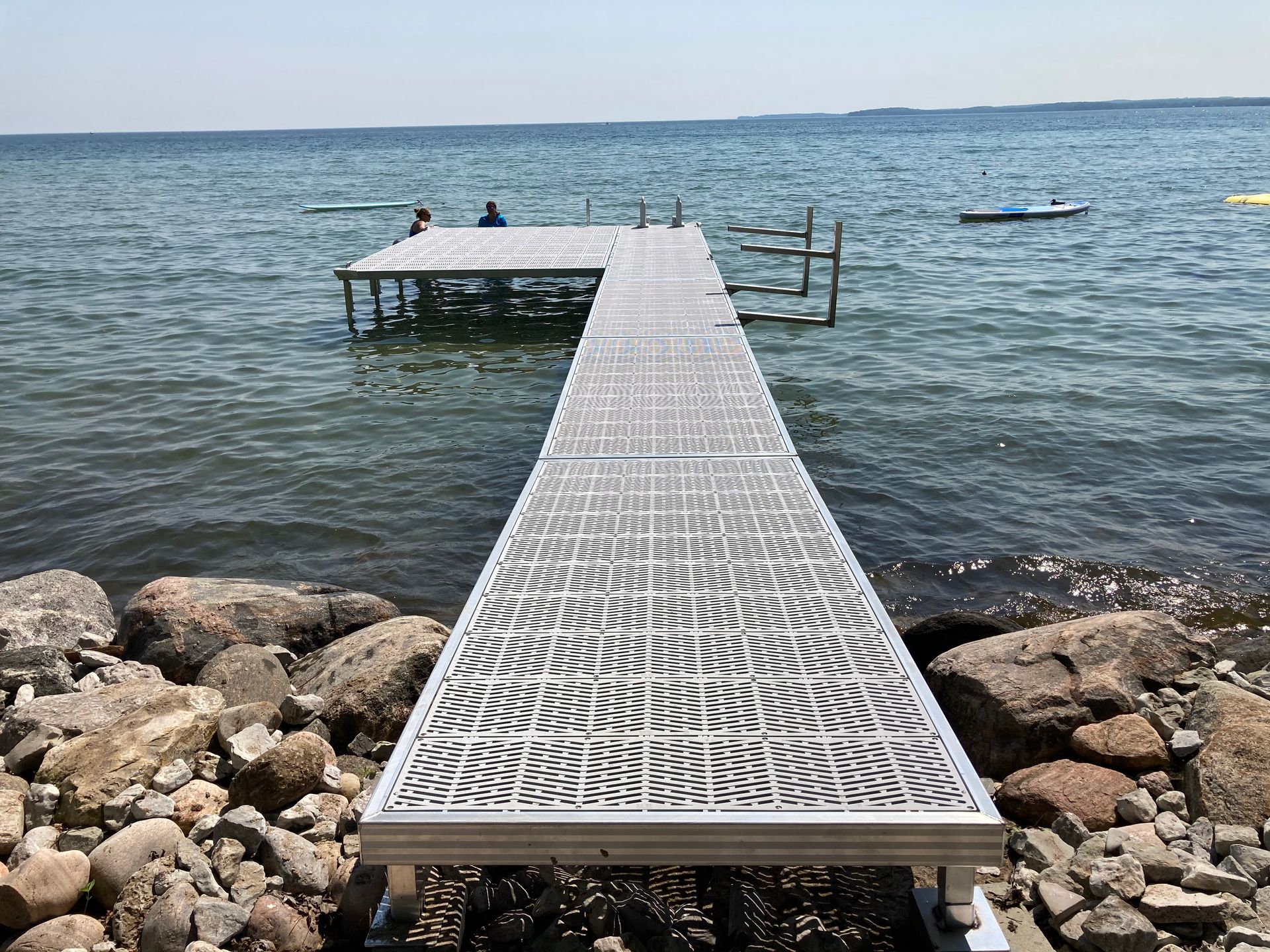 A long dock leading into a body of water.