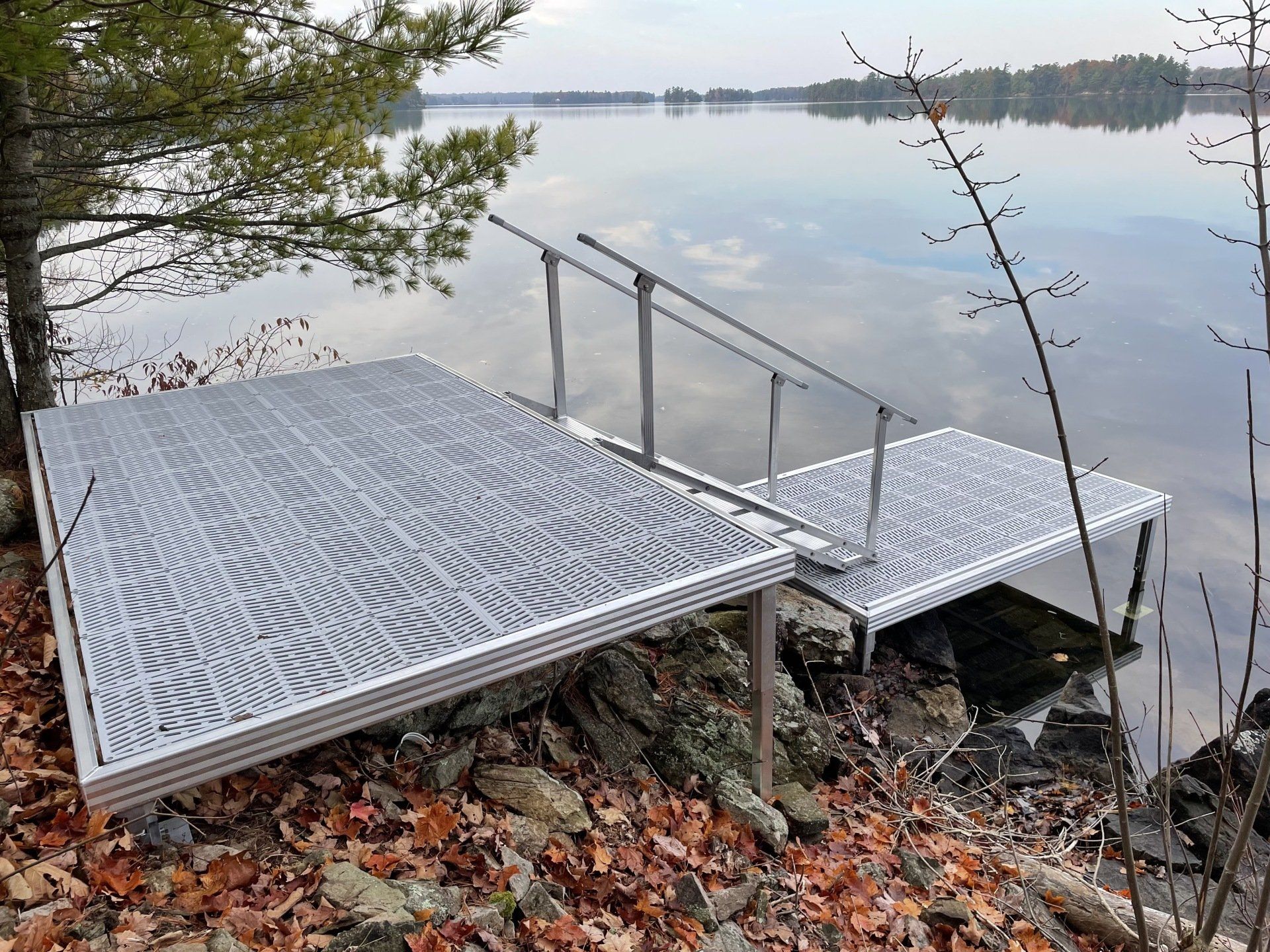 A metal dock with stairs leading to the water