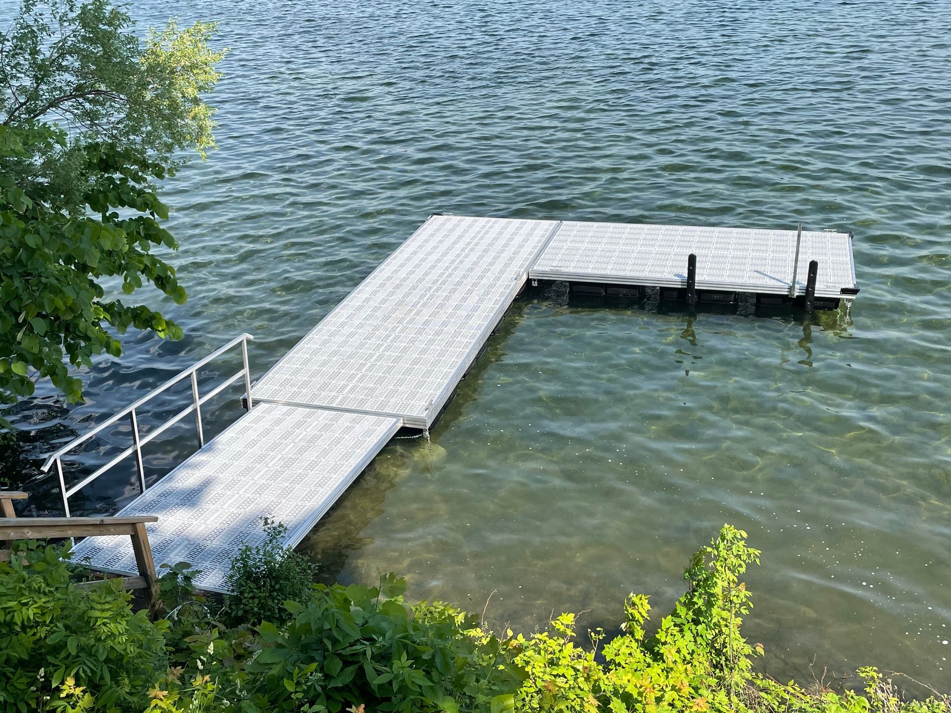 A dock is sitting in the middle of a lake.