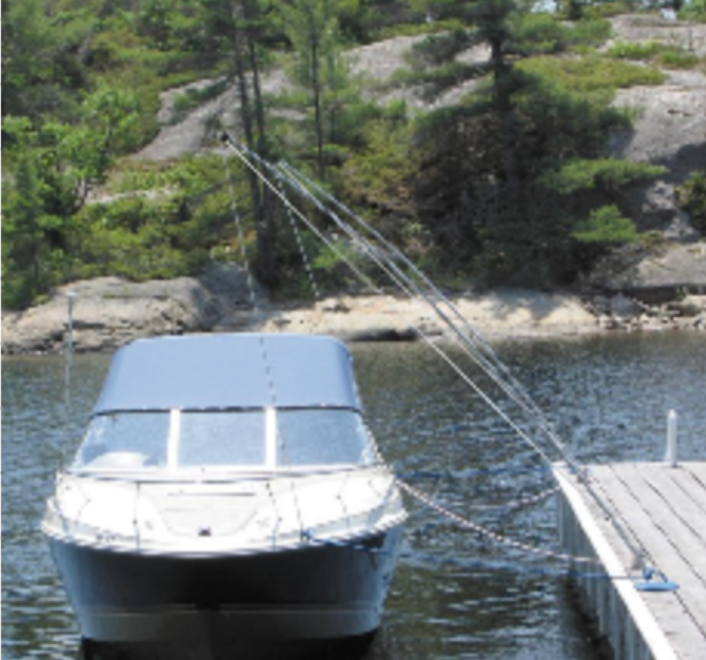 A boat is tied to a dock in the water