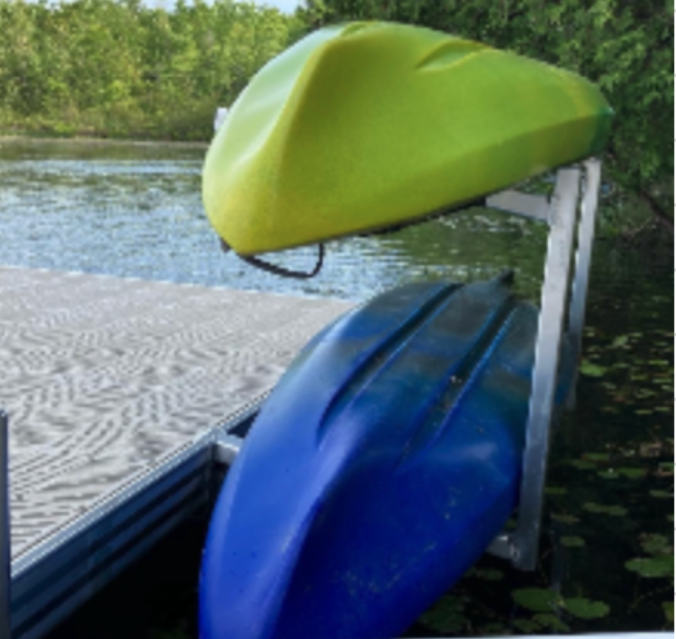 A yellow kayak sits on top of a blue kayak