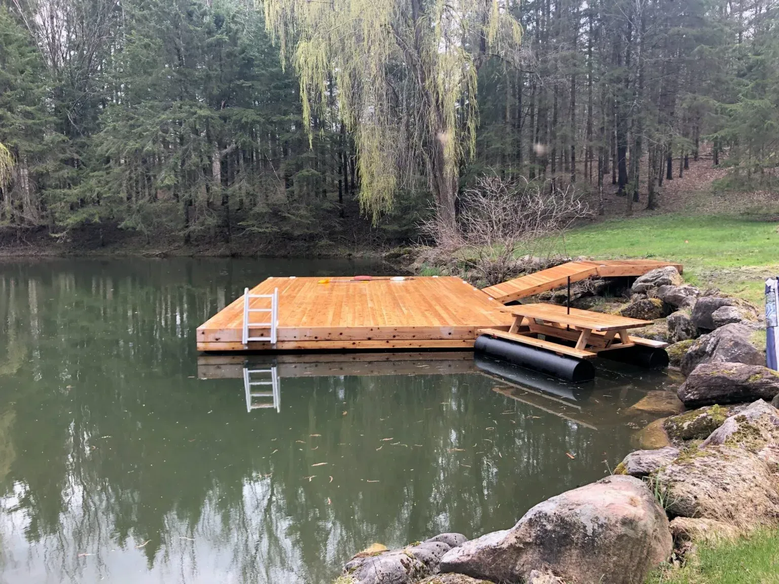 A floating wooden dock  on the shoreline