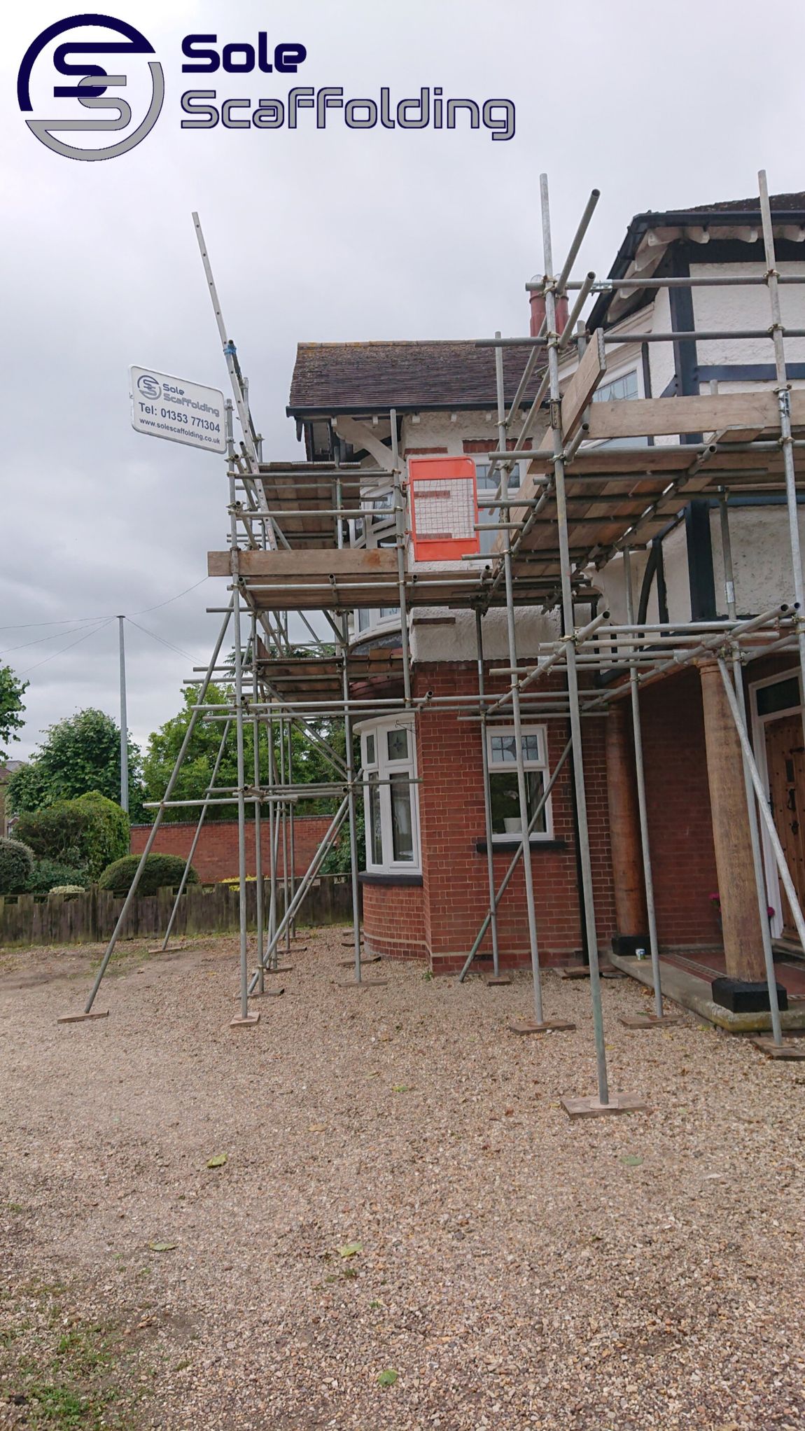 sole scaffolding - scaffold for painting works on a house in March