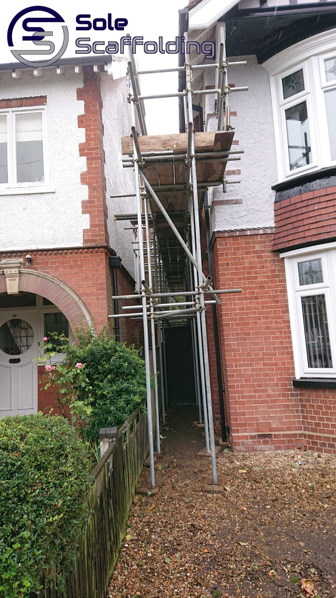 sole scaffolding - scaffold for painting works on a house in March