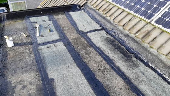 a roof with a solar panel on top of it