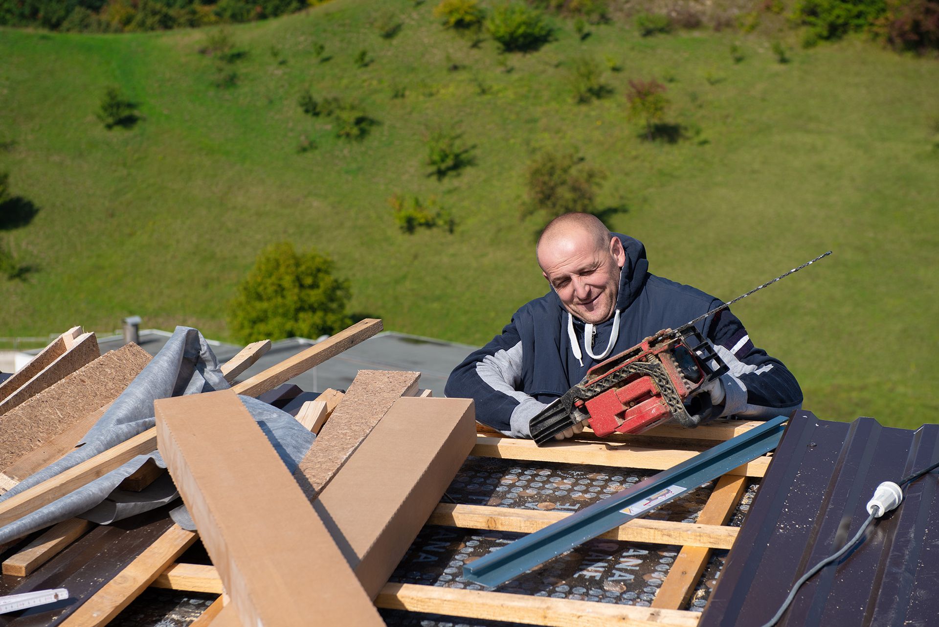 a man working on a roof with tools