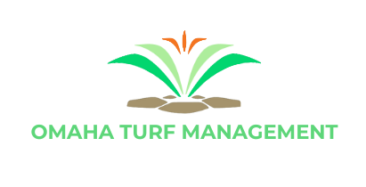 The logo for omaha turf management shows a plant growing out of the ground.