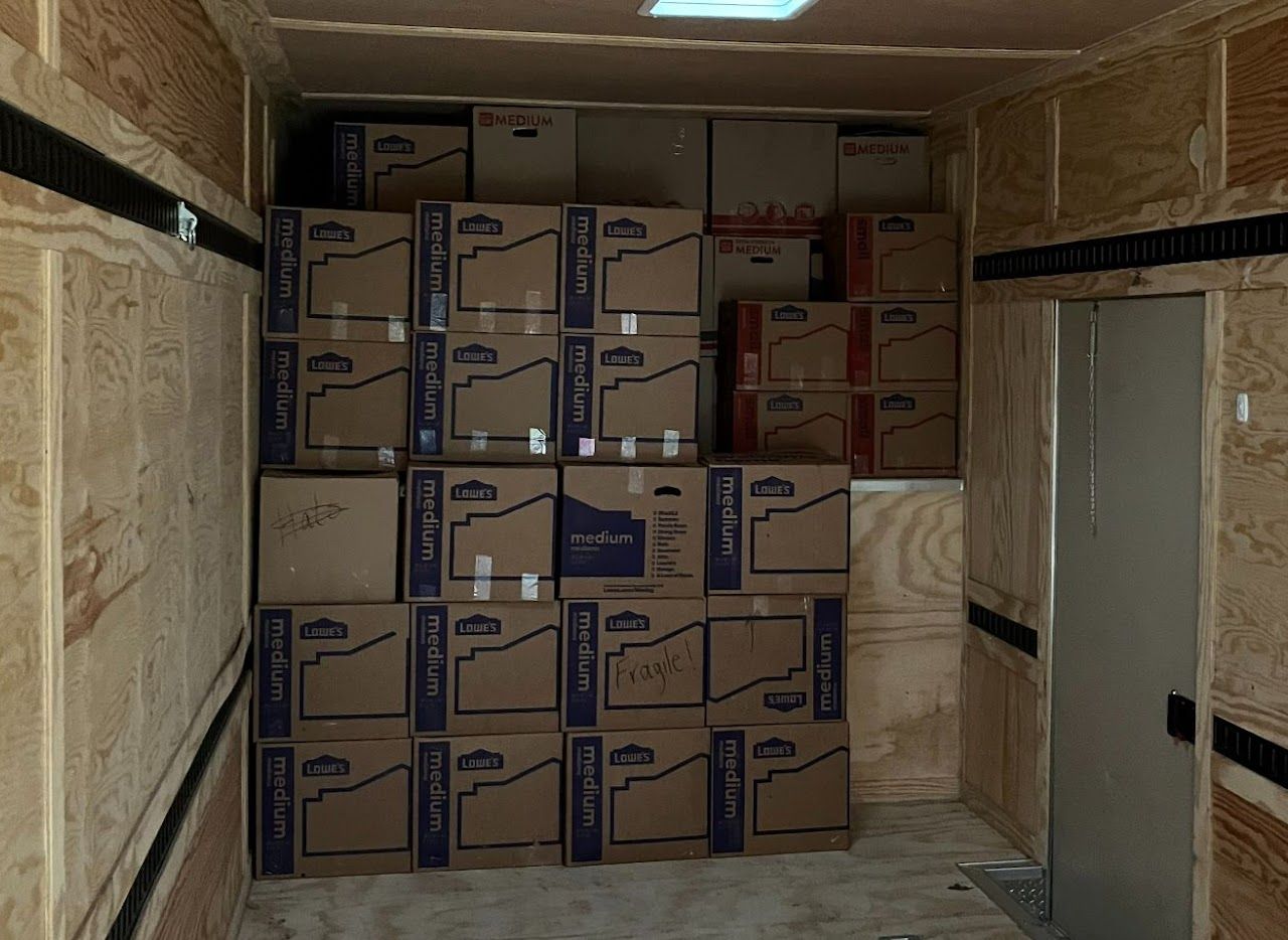 A warehouse filled with lots of cardboard boxes.