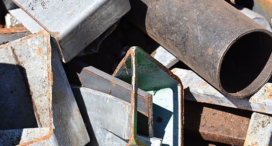 A Pile of Rusty Metal Pieces Sitting on Top of Each Other — Newport Recycling in Woree, QLD