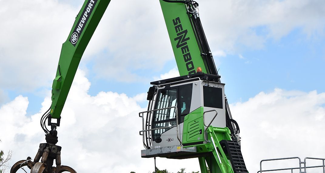 A White Truck is Parked Next to a White Truck in a Garage — Newport Recycling in Woree, QLD