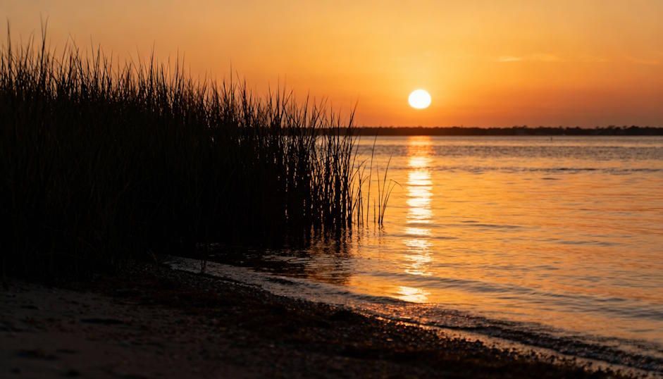A peaceful Chesapeake sunset over the Intracoastal Waterway, symbolic of calm after pain