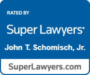 a blue sign that says `` super lawyers john t. schomisch , jr. ''  | Green Bay, WI | One Law Group S.C.